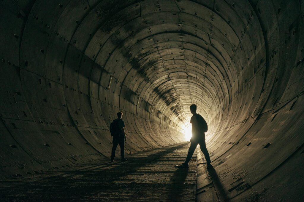 two people in a tunnel