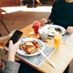 two dinner plates on square brown wooden bar table