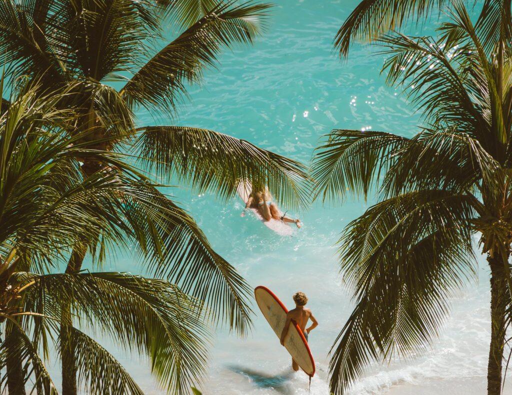 people with surfboards on a beach
