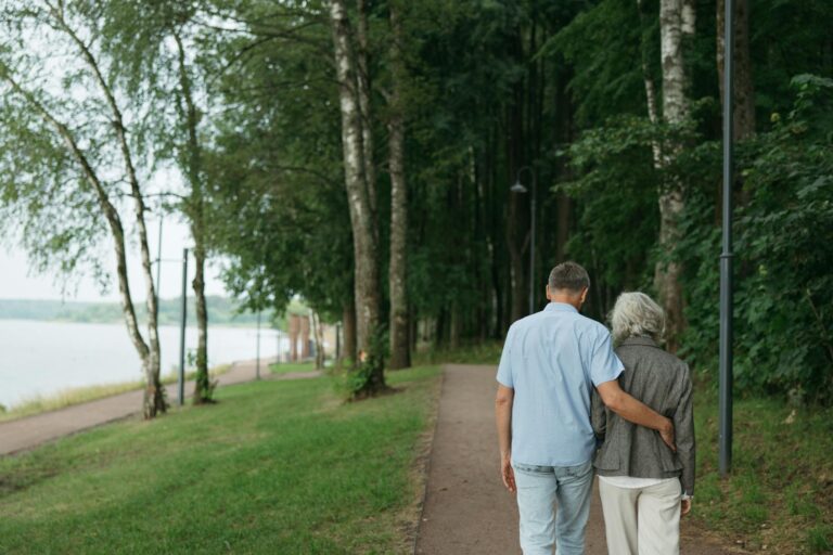 man and woman walking on the park