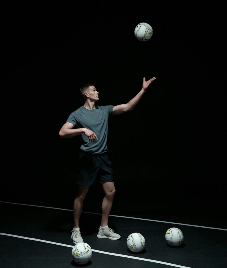 photo of a man playing volleyball