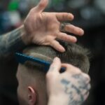 person combing person s hair