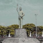 hero monument in the middle of the dam