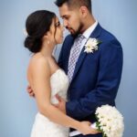 bride and groom standing next to each other