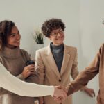 men and women smiling