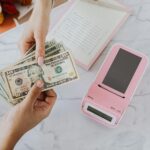 hands holding dollars