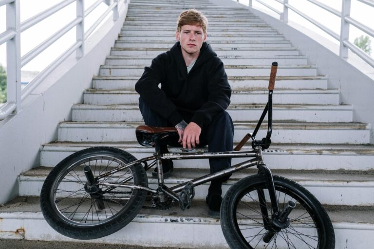 man in black jacket sitting on black wheel chair