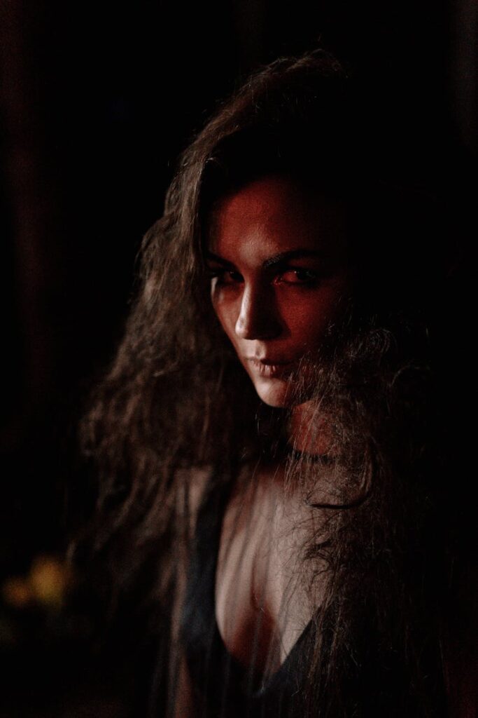 a woman seriously looking at the camera