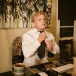 man in white dress shirt sitting on chair
