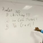 teacher giving instructions not to cheat
