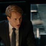 a man in a suit talking