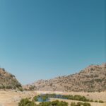 clear sky over stream and hills