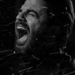 depressed man shouting black and white