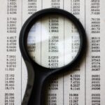 magnifying glass on textbook