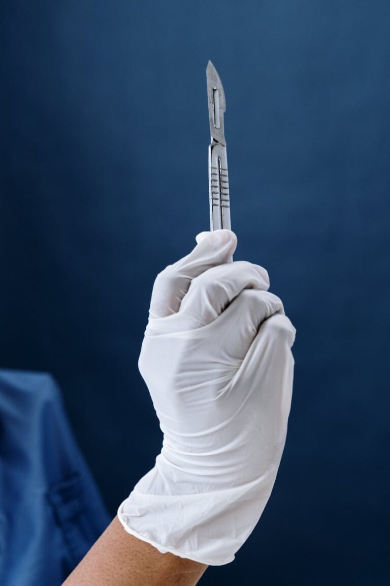 close up shot of a person holding a scalpel